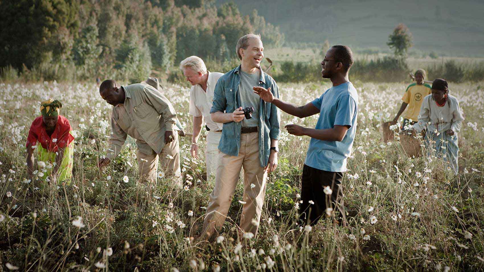 Fisk Johnson and pyrethrum farmers learning sustainable farming techniques in Rwanda